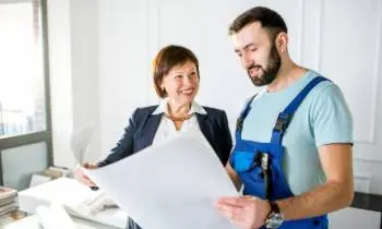plumber and plans with client